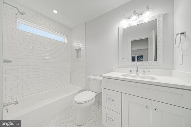 full bath with  shower combination, vanity, toilet, and tile patterned floors