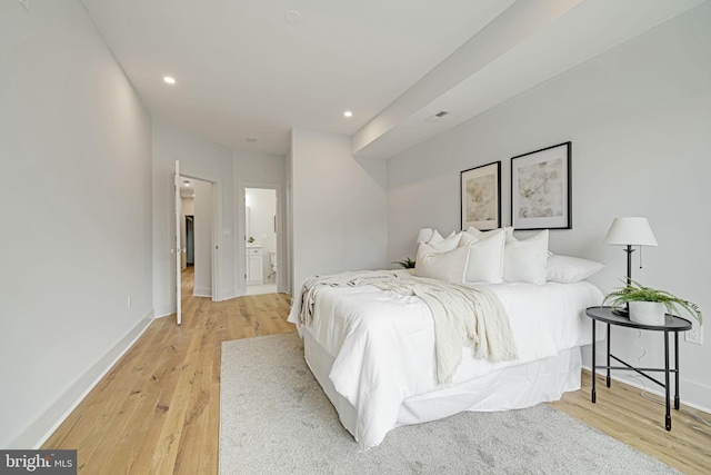 bedroom with recessed lighting, baseboards, and light wood finished floors