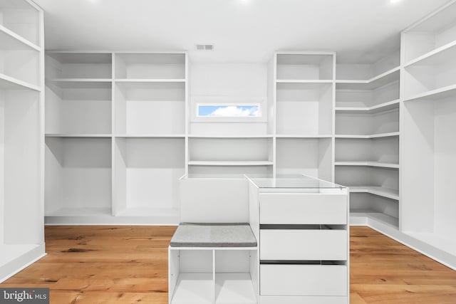 spacious closet featuring visible vents and light wood finished floors