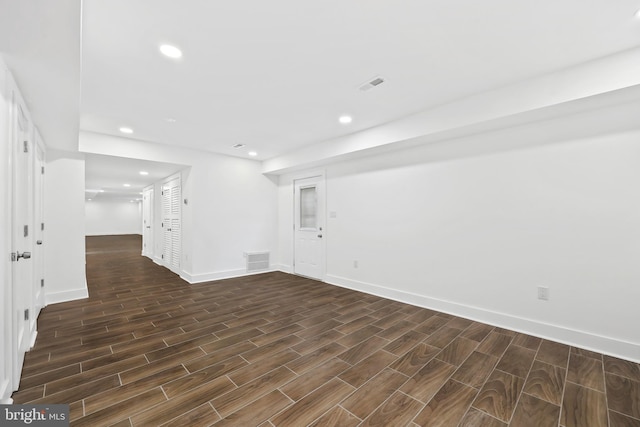 empty room with recessed lighting, visible vents, and wood tiled floor