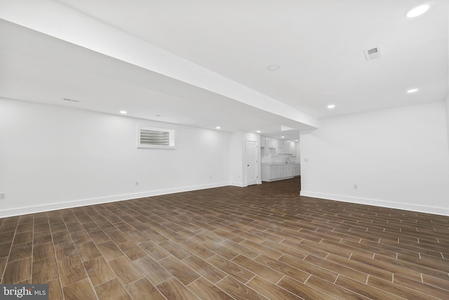 unfurnished living room featuring recessed lighting, visible vents, baseboards, and wood finished floors