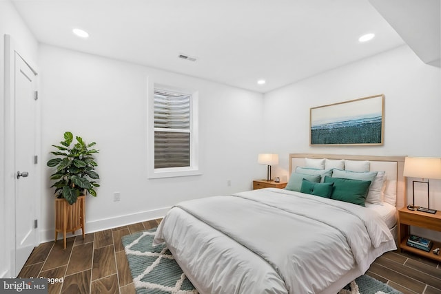 bedroom featuring recessed lighting, visible vents, and wood tiled floor