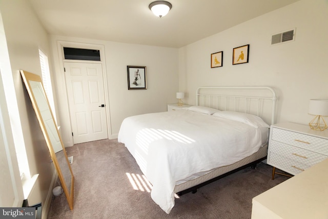 carpeted bedroom with visible vents