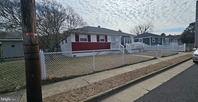 view of front facade with a fenced front yard