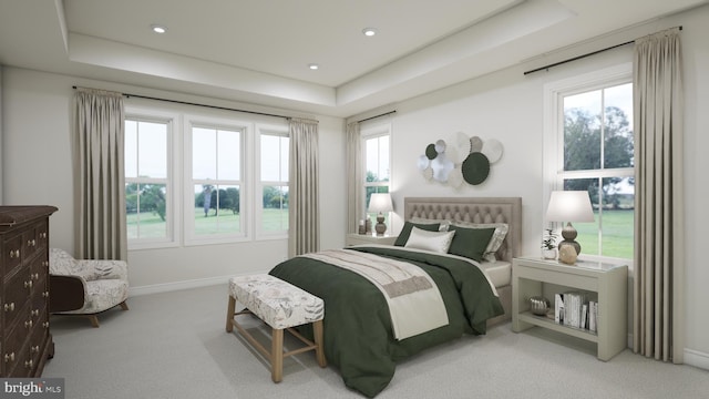 carpeted bedroom featuring a tray ceiling, multiple windows, and recessed lighting