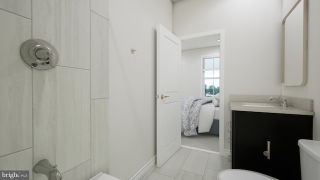 full bathroom with a shower, vanity, and toilet