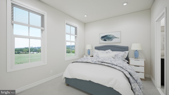 bedroom featuring light carpet, recessed lighting, and baseboards