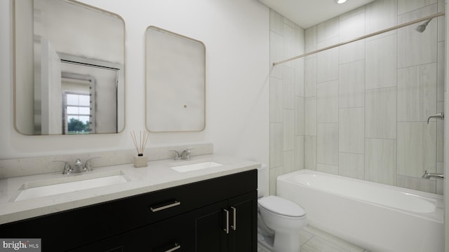 full bath featuring double vanity, a sink, toilet, and tub / shower combination