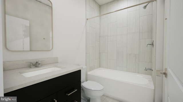 bathroom featuring washtub / shower combination, vanity, and toilet