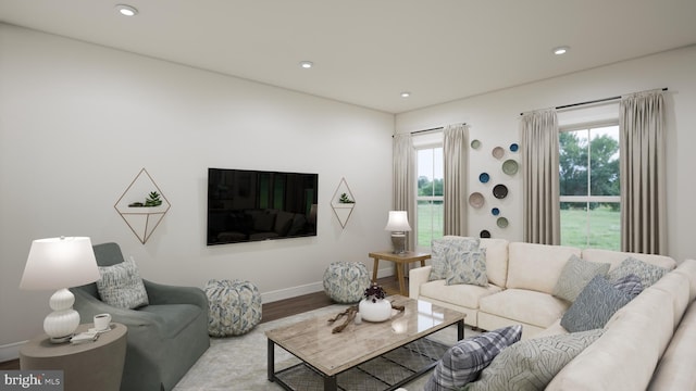 living room featuring recessed lighting, baseboards, and wood finished floors