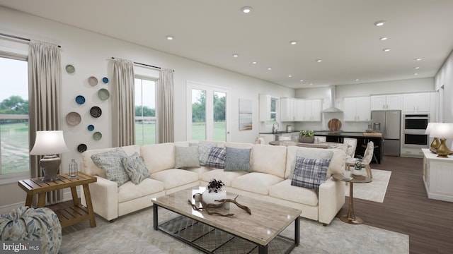 living room with recessed lighting and light wood-style flooring