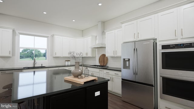 kitchen featuring a center island, backsplash, dark countertops, appliances with stainless steel finishes, and a sink