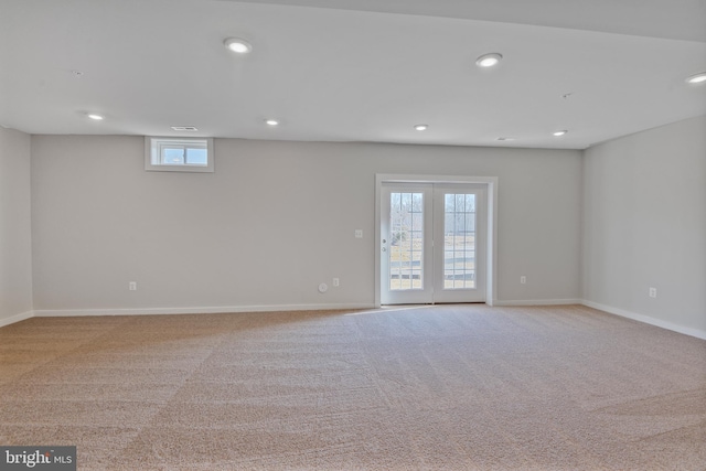 carpeted empty room with recessed lighting and baseboards