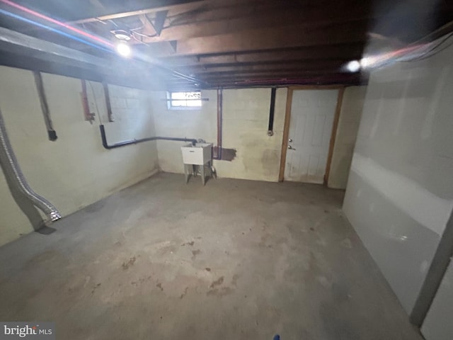 basement featuring a sink