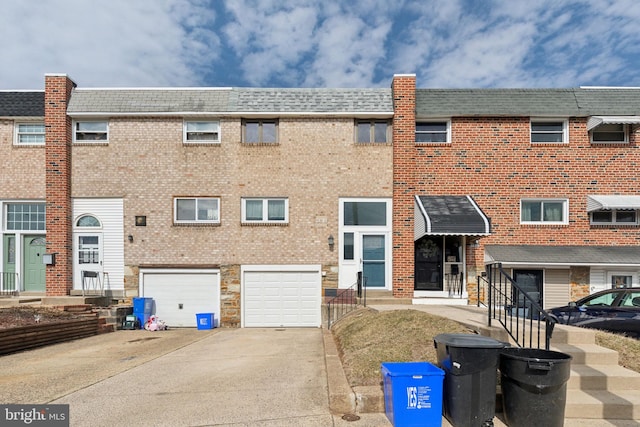 exterior space with driveway and an attached garage