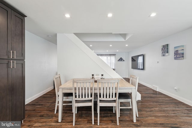 dining space featuring baseboards, dark wood-style flooring, and recessed lighting