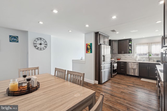 dining space featuring dark wood-style floors, visible vents, and recessed lighting