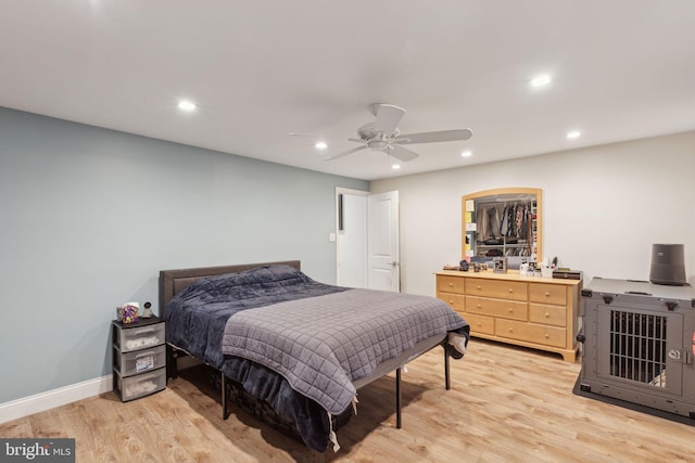 bedroom with recessed lighting, ceiling fan, light wood-style flooring, and baseboards