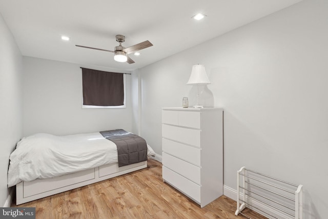 bedroom with light wood finished floors, ceiling fan, baseboards, and recessed lighting