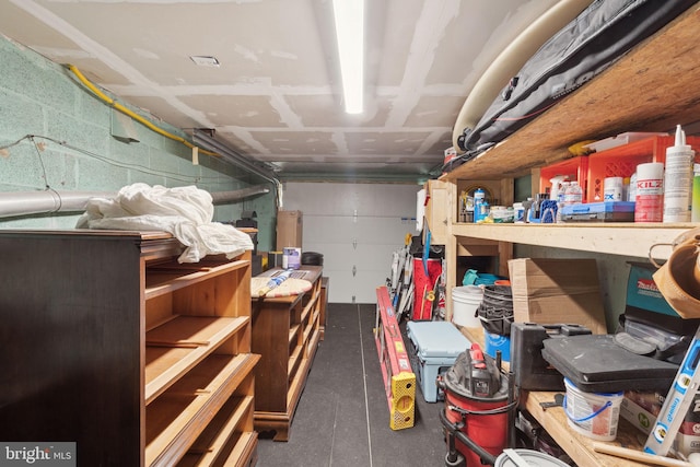 garage with concrete block wall