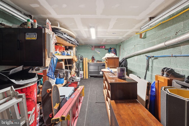 interior space with concrete block wall