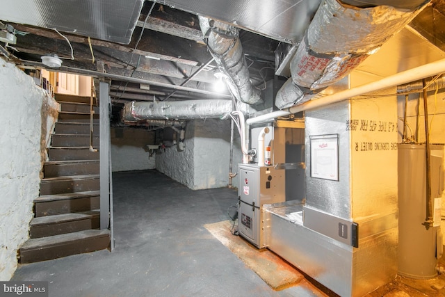 unfinished basement featuring water heater and stairway