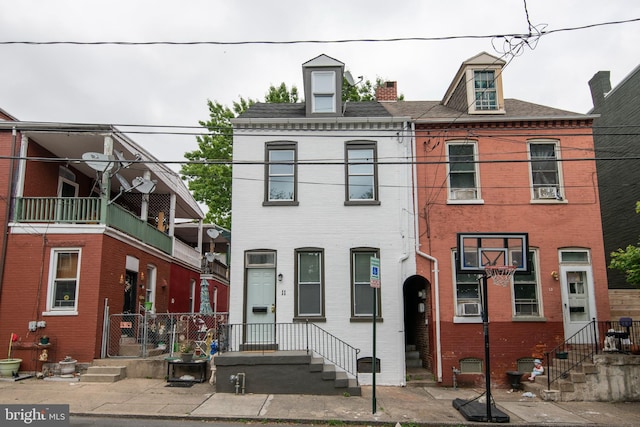 townhome / multi-family property featuring brick siding