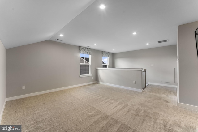 empty room featuring recessed lighting, visible vents, and light carpet