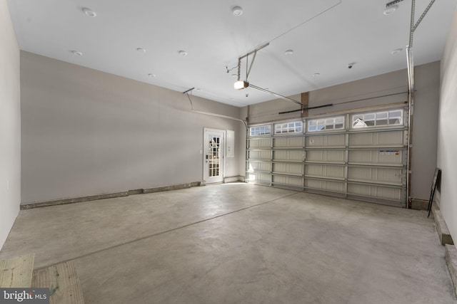 garage featuring baseboards and a garage door opener