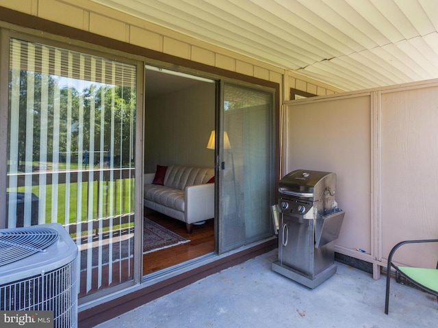 view of patio / terrace with central air condition unit and area for grilling