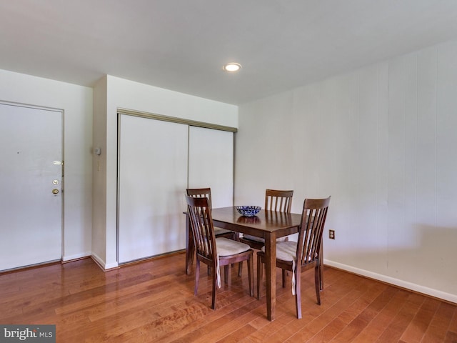 dining area featuring wood finished floors and baseboards