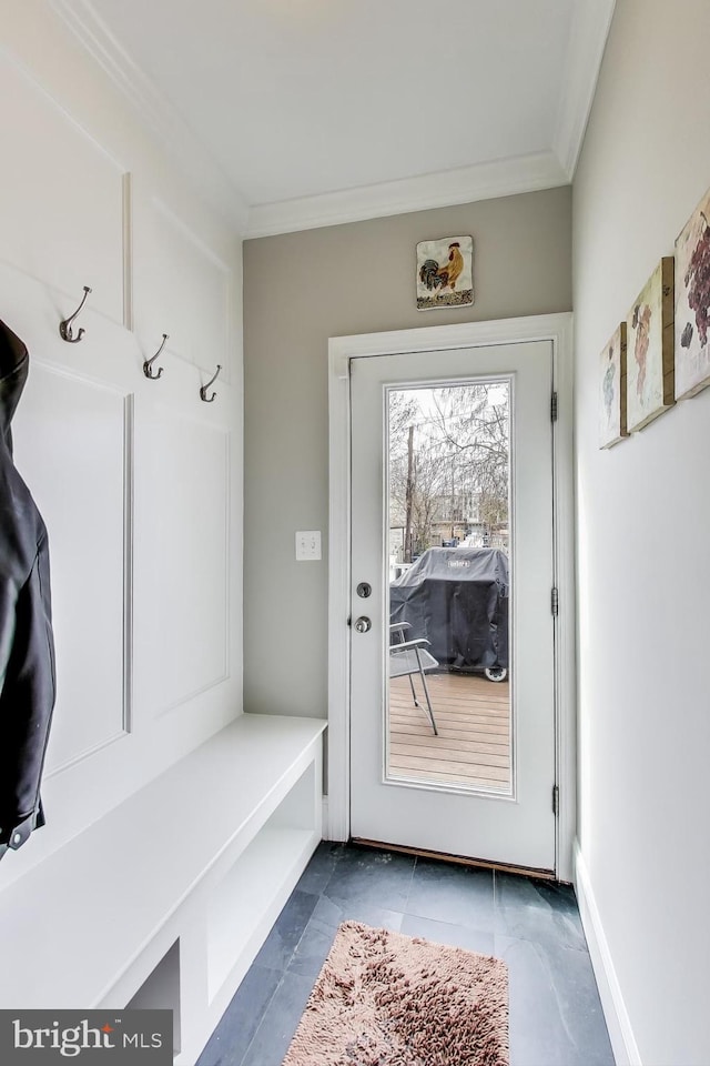 mudroom featuring baseboards and ornamental molding