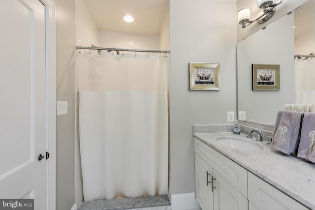 full bathroom featuring vanity and a shower with curtain