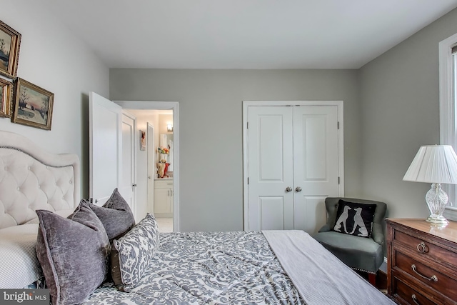 bedroom with a closet and ensuite bathroom