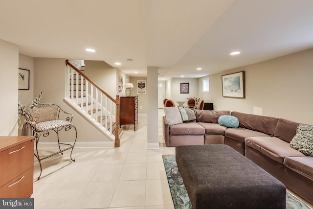 living area featuring recessed lighting, stairway, baseboards, and light tile patterned flooring