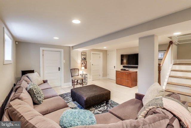 living area featuring light tile patterned floors, recessed lighting, stairs, and baseboards