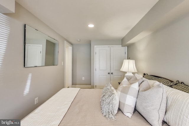 bedroom featuring a closet and recessed lighting