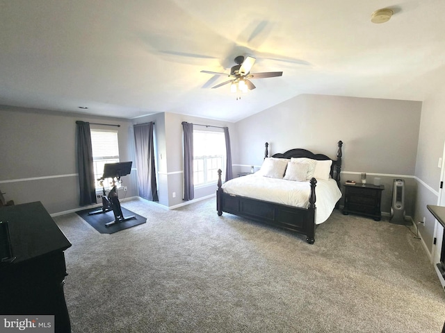 bedroom with lofted ceiling, baseboards, a ceiling fan, and carpet flooring