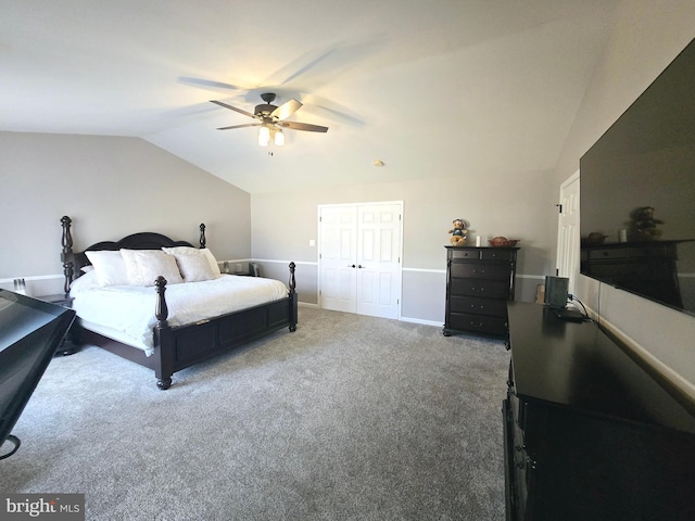 carpeted bedroom with vaulted ceiling, baseboards, and ceiling fan