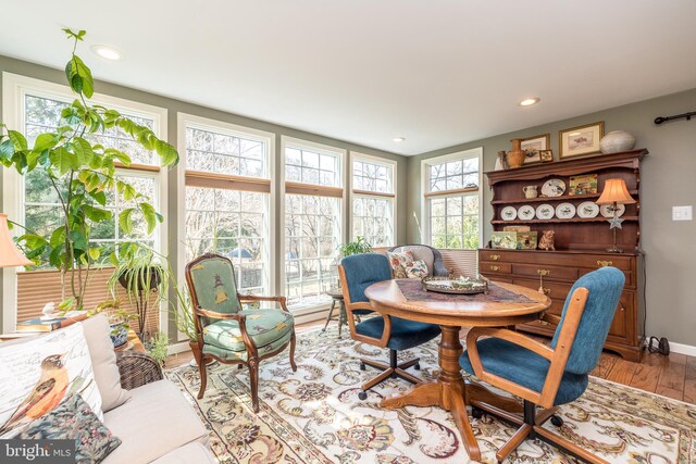 dining space featuring baseboards, light wood-style flooring, and recessed lighting