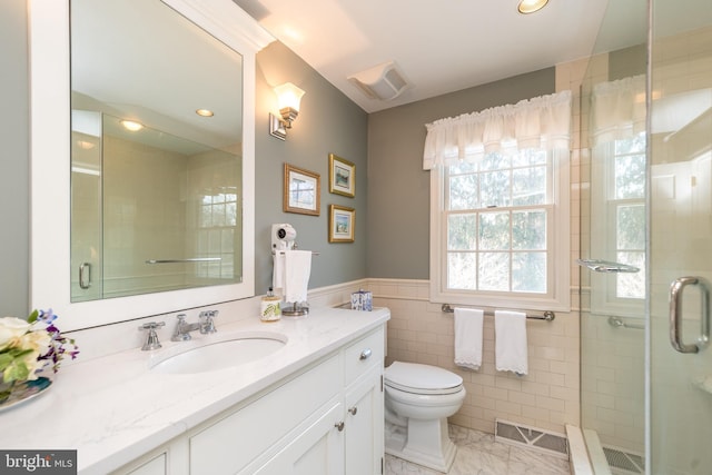 full bathroom featuring marble finish floor, visible vents, a shower stall, and vanity