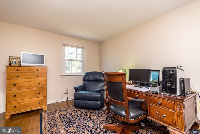 home office with wood finished floors and baseboards