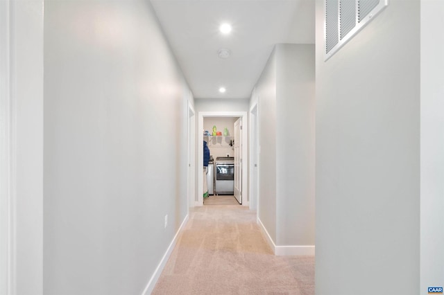 corridor with light carpet, baseboards, visible vents, and recessed lighting