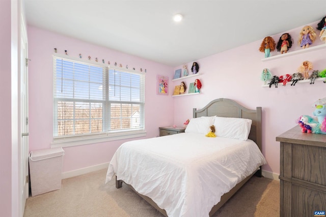 carpeted bedroom with baseboards