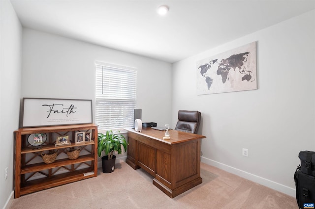 home office featuring light carpet and baseboards