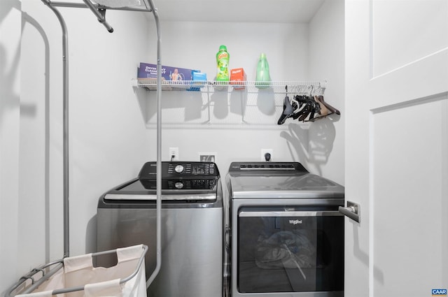 laundry area with laundry area and washer and clothes dryer