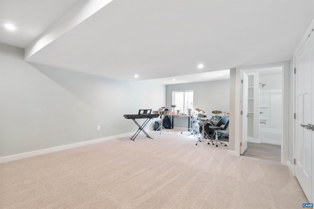 office space with light carpet, baseboards, and recessed lighting