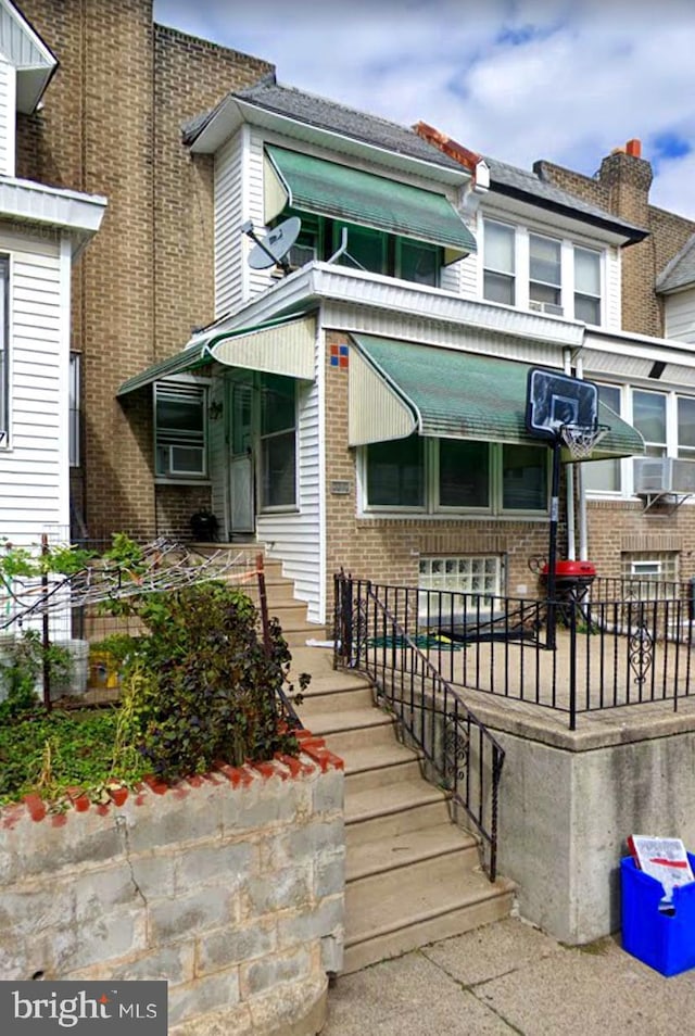 view of front of home featuring brick siding