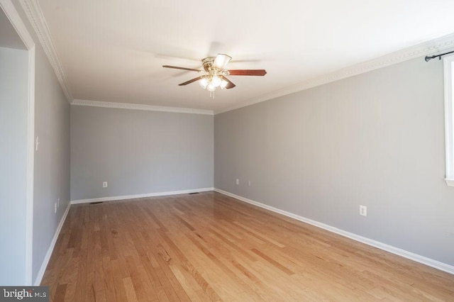 empty room with light wood-style flooring, crown molding, baseboards, and a ceiling fan