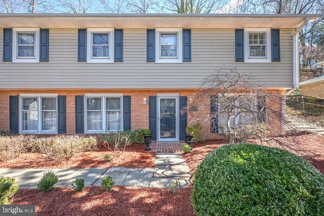 colonial home with brick siding